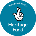 A teal circle with a ha white hand with crossed fingers. Text above reads Made possible with. White text below reads Heritage Fund.