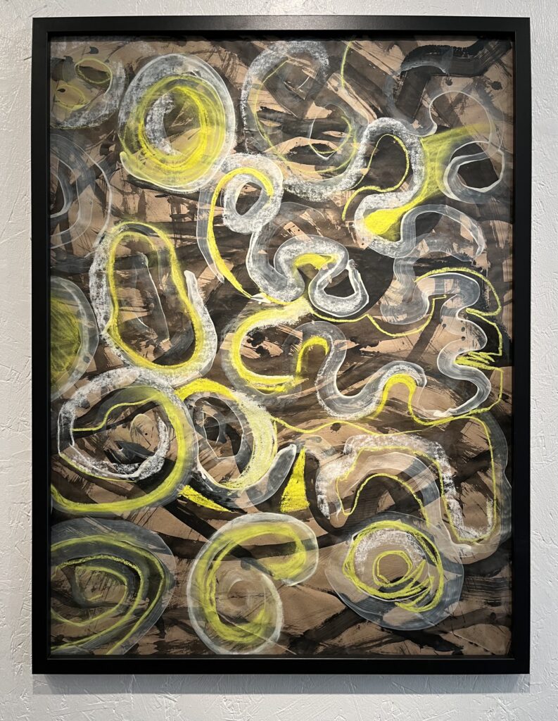 Ink drawing, squiggly overlapping lines of fluorescent yellow, white and beige ink cover a darker background